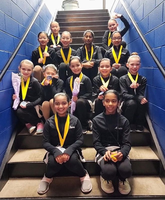 Richmond VA Aspire Team Sitting on the Steps with Medals