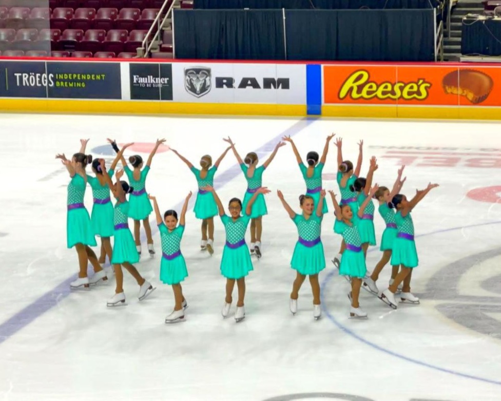 aspire 2 team from richmond va on ice ending their routine after a competition